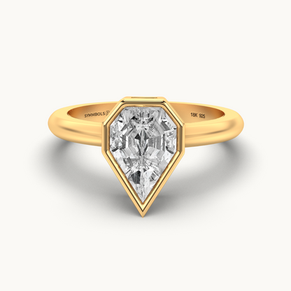 A teardrop-shaped diamond ring with a yellow gold band.